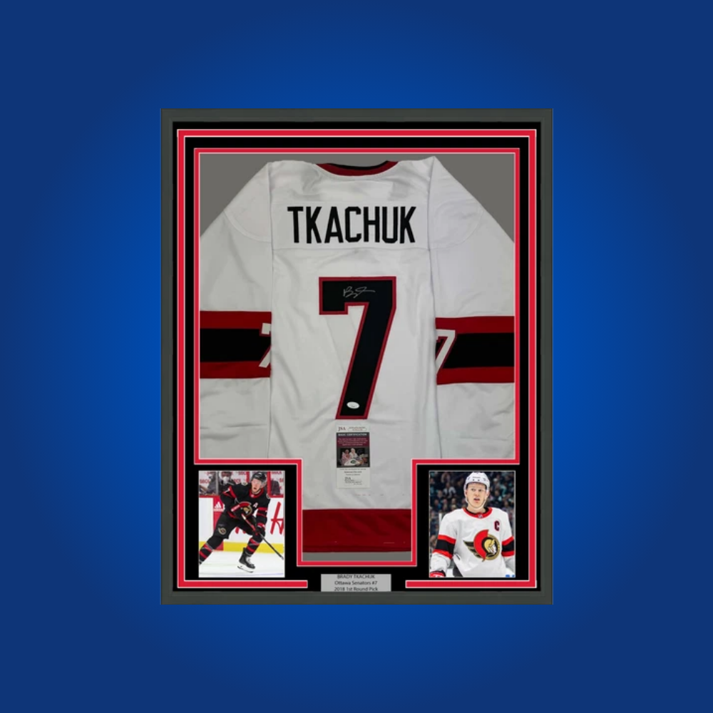 Brady Tkachuk’s full framed Ottawa Senators white jersey, personally signed, is a vibrant collectible for fans, honoring the team’s dynamic captain and leadership on and off the ice.