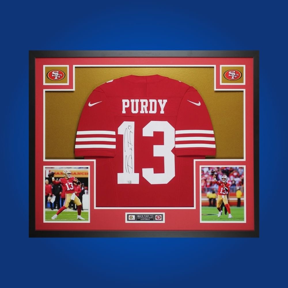 Framed San Francisco 49ers jersey signed by Brock Purdy with action photos and Certificate of Authenticity
