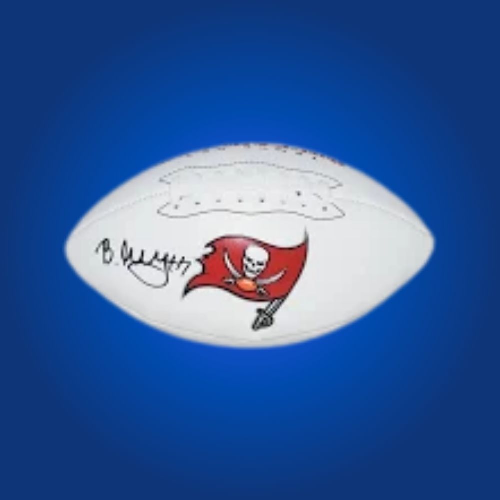 Bucky Irving signed Buccaneers logo football, featuring emerging player’s signature and team emblem.