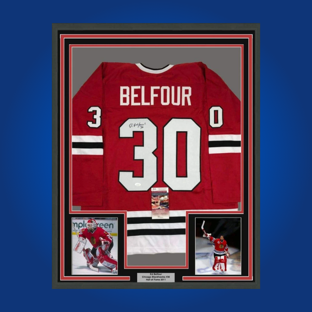Ed Belfour’s autographed full framed Chicago Blackhawks red jersey is a superb collectible for fans, commemorating the Hall of Fame goaltender’s achievements in Chicago.