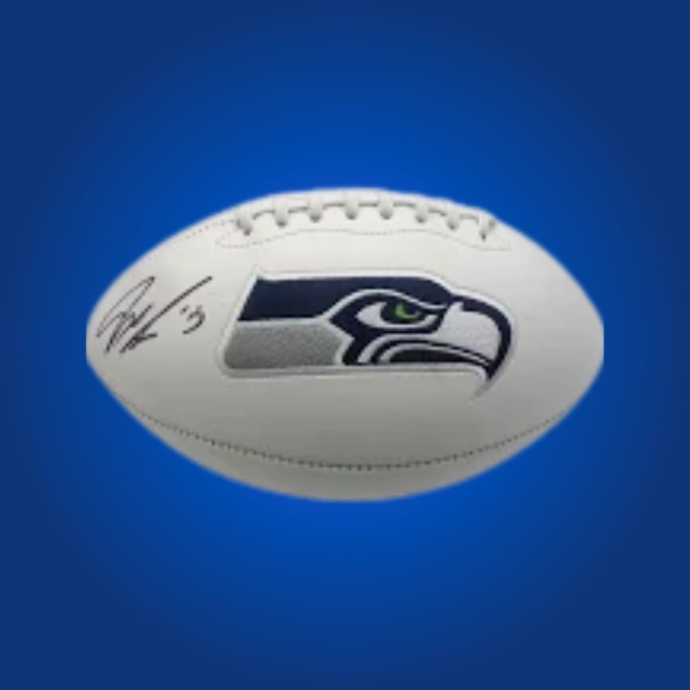 Jaxon Smith-Njigba signed Seahawks logo football, showcasing rookie wide receiver’s autograph and team logo.