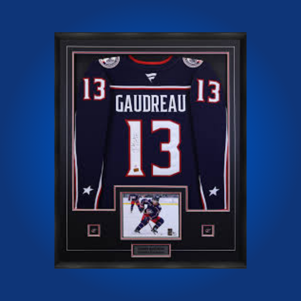 Johnny Gaudreau’s signed full framed Columbus Blue Jackets navy blue jersey is a premier collectible, celebrating the star winger’s arrival and dynamic play in Columbus.