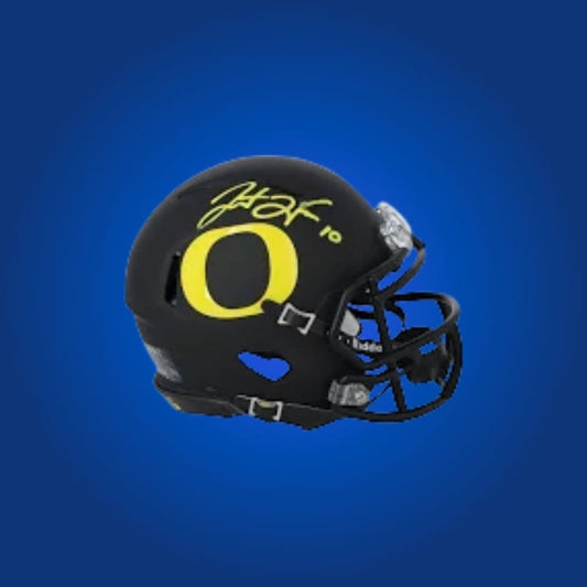 Justin Herbert signed Oregon Ducks mini helmet—prized item for Ducks fans and Herbert memorabilia enthusiasts.