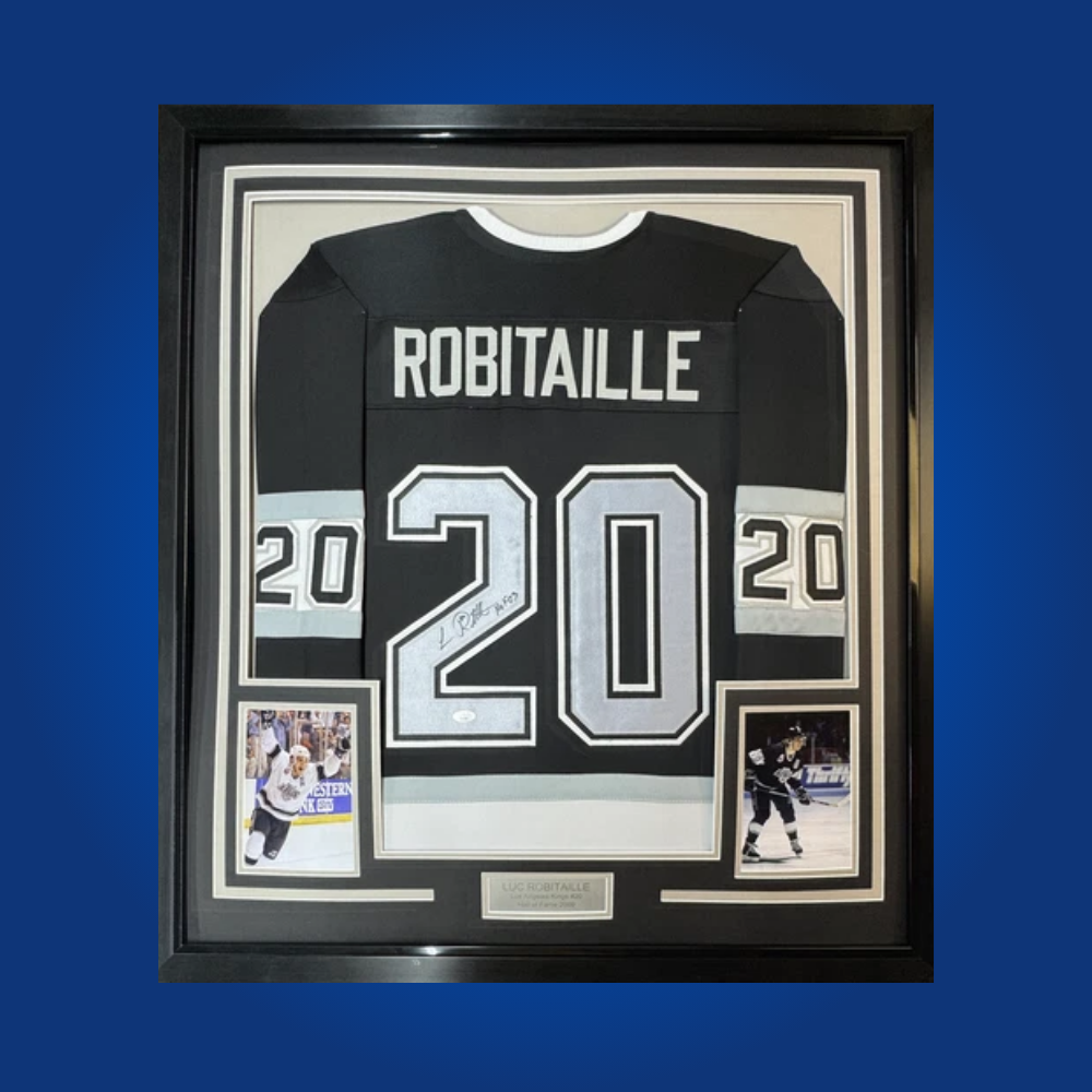 Luc Robitaille’s signature on this full framed Los Angeles Kings black jersey commemorates the Hall of Famer’s scoring prowess and lasting legacy with the franchise.