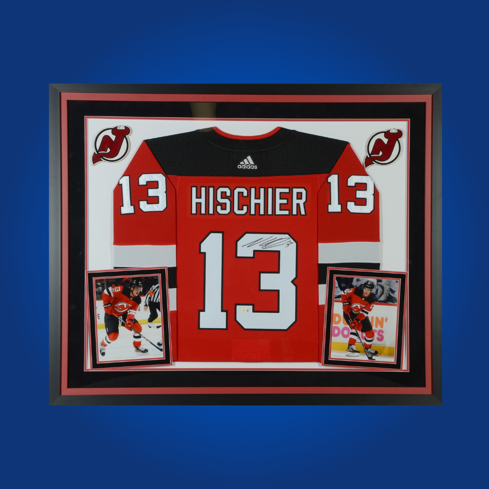 Nico Hischier’s autographed full framed New Jersey Devils red jersey is an exciting collectible for fans, spotlighting the current captain’s leadership and skill.