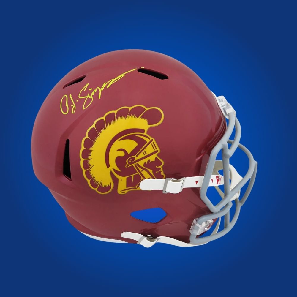 Autographed full size replica helmet by O.J. Simpson, legendary USC Trojans running back and Heisman Trophy winner, showcased on a crisp white background for a distinctive memorabilia presentation. A rare collectible for fans. SportsMarkets product photo.