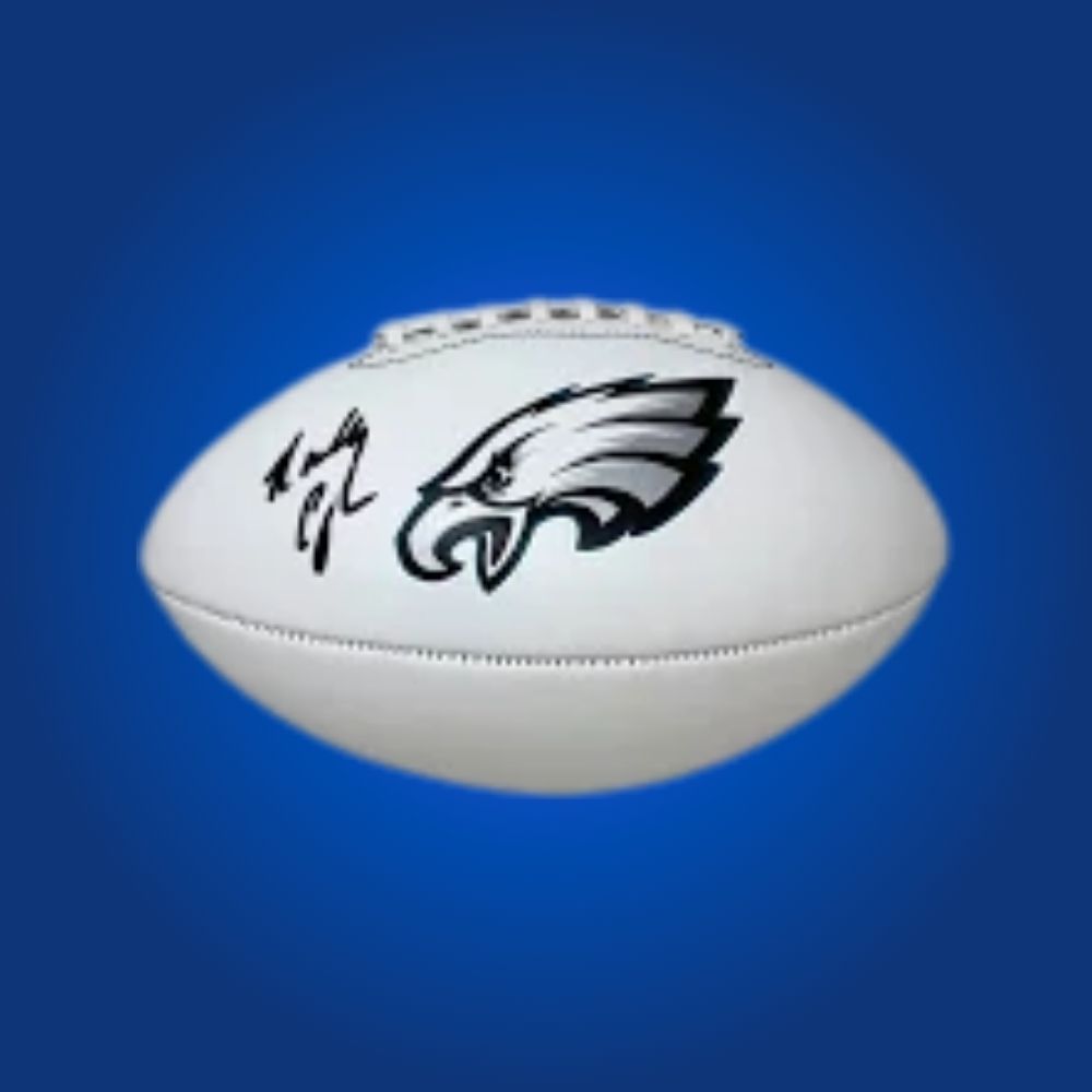 Randall Cunningham autographed Eagles logo football, featuring team logo and quarterback signature.