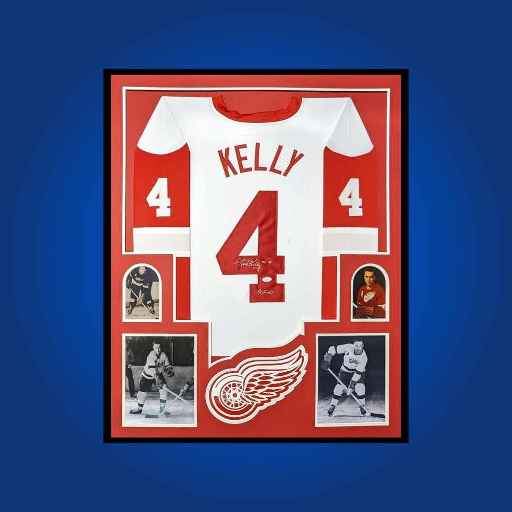 Red Kelly’s full framed Detroit Red Wings white jersey, signed and authenticated, offers collectors a piece of hockey history from one of the most versatile and decorated players in NHL lore.