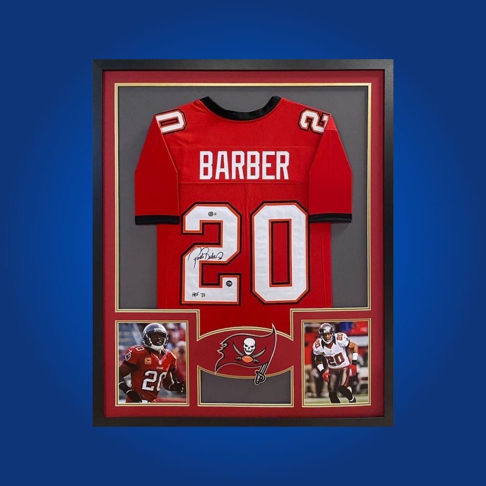 Autographed Tampa Bay Buccaneers custom jersey by Ronde Barber with Certificate of Authenticity.