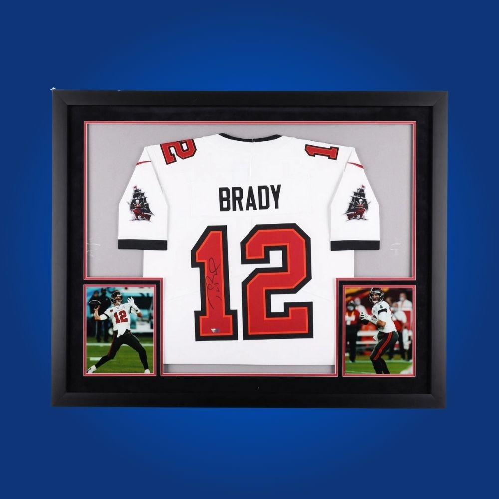 Framed Tampa Bay Buccaneers jersey signed by Tom Brady with action photos and Certificate of Authenticity
