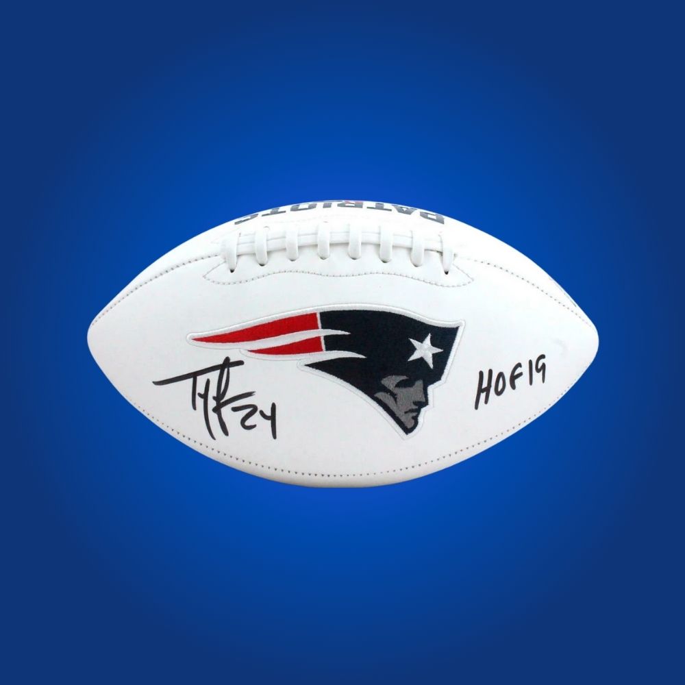 Official football signed by Ty Law, featuring New England Patriots branding and player autograph.