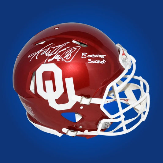 Autographed Oklahoma Sooners full size Authentic Helmet signed by Adrian Peterson, displayed on a white background. SportsMarkets memorabilia product photo.