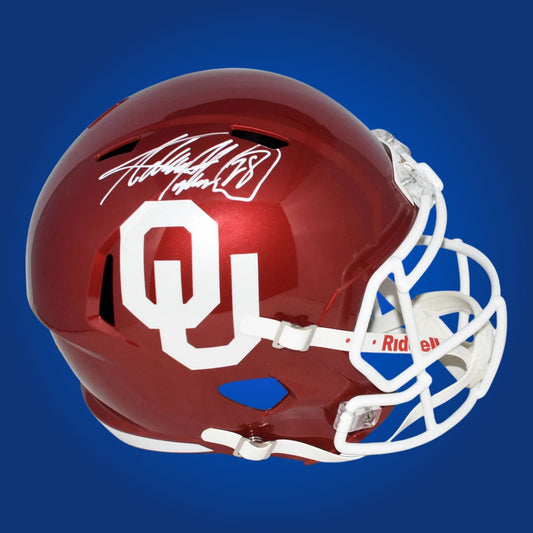 Autographed Oklahoma Sooners full size replica helmet signed by Adrian Peterson, displayed on a white background. SportsMarkets memorabilia product photo.