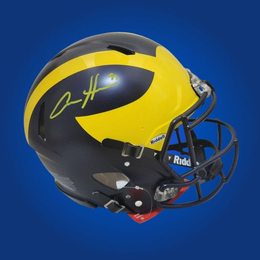 Autographed Michigan Wolverines full size Authentic Helmet signed by Aidan Hutchinson, displayed against a white background for product clarity. SportsMarkets product photo.