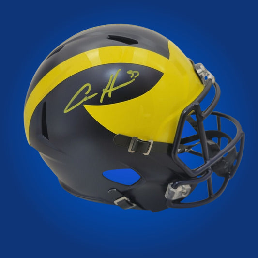 Autographed Michigan Wolverines full size replica helmet signed by Aidan Hutchinson, displayed against a white background for product clarity. SportsMarkets product photo.