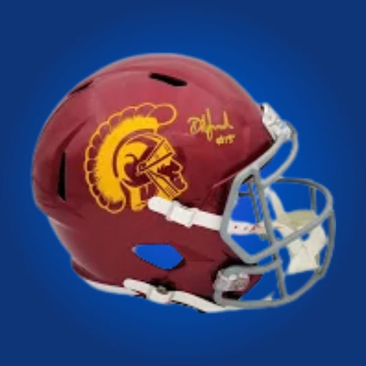 Autographed full size replica helmet by Amon-Ra St. Brown, standout USC Trojans wide receiver and NFL star, displayed on a clean white backdrop for visual emphasis. Ideal for collectors and USC fans. SportsMarkets memorabilia product image.