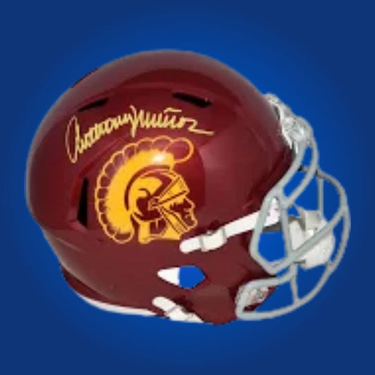 Autographed full size replica helmet by Anthony Munoz, legendary USC Trojans offensive lineman and Pro Football Hall of Famer, presented against a pristine white background for clarity. Perfect for memorabilia collectors and Trojans supporters. SportsMarkets photo.