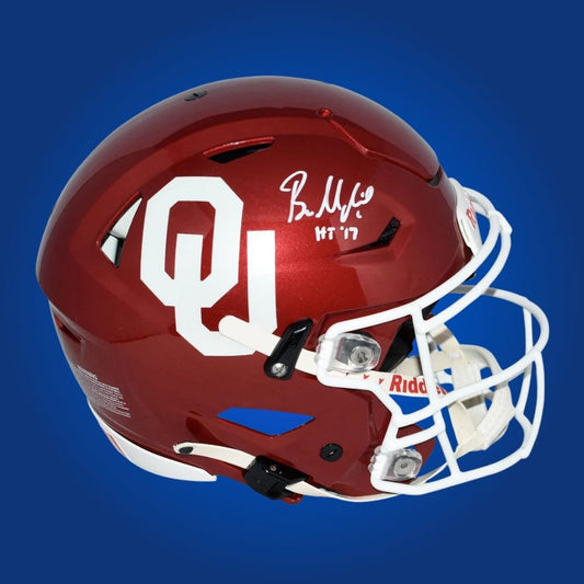 Autographed Oklahoma Sooners full size Authentic Helmet signed by Baker Mayfield, showcased against a white background. SportsMarkets authentic memorabilia image.