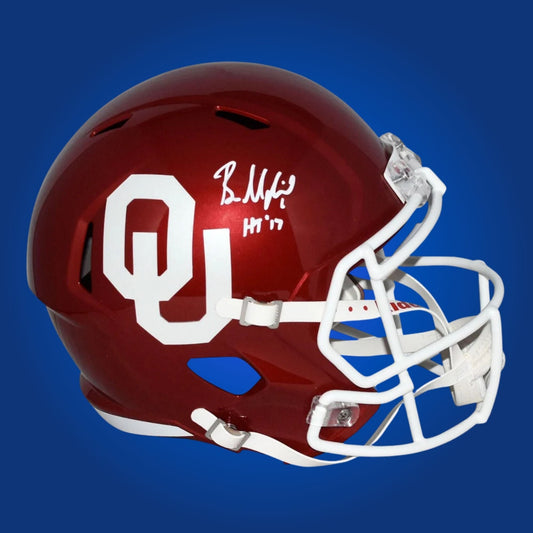 Autographed Oklahoma Sooners full size replica helmet signed by Baker Mayfield, showcased against a white background. SportsMarkets authentic memorabilia image.