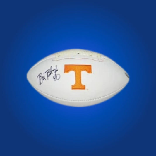Autographed full size replica football by Bill Bates, featuring Tennessee Volunteers white logo. Certified authentic, perfect for dedicated Tennessee fans and collectors. Certificate of Authenticity included. Ball details may differ for catalog consistency.