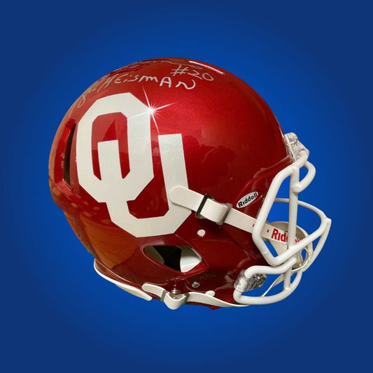 Autographed Oklahoma Sooners full size Authentic Helmet signed by Billy Sims, displayed on a clean white background. SportsMarkets memorabilia photo.