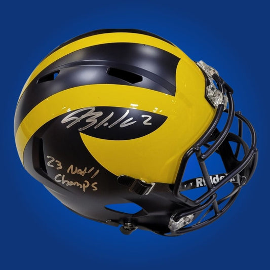 Autographed Michigan Wolverines full size Authentic Helmet signed by Blake Corum, showcased on a white background. SportsMarkets authenticated memorabilia image.