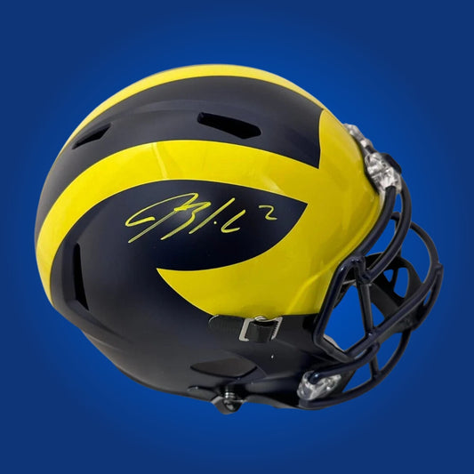 Autographed Michigan Wolverines full size replica helmet signed by Blake Corum, showcased on a white background. SportsMarkets authenticated memorabilia image.