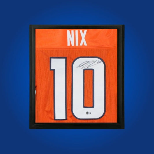 Bo Nix hand-signed orange framed Denver Broncos jersey, showcasing signature and official team graphics. A unique collectible for Broncos fans and Nix memorabilia collectors. Includes Certificate of Authenticity. Images may differ for catalog uniformity.