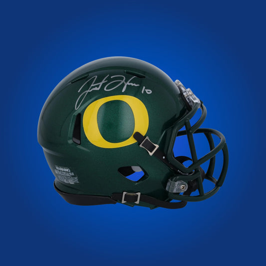 Autographed Oregon Ducks full size Authentic Helmet signed by Justin Herbert shown on a white background for product clarity. SportsMarkets memorabilia photo.