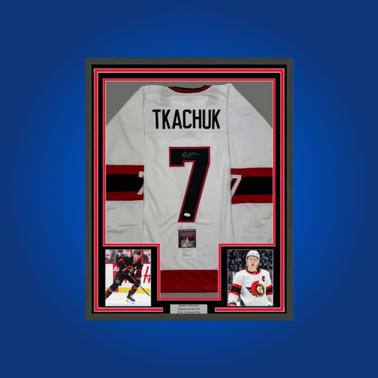 Brady Tkachuk’s full framed Ottawa Senators white jersey, personally signed, is a vibrant collectible for fans, honoring the team’s dynamic captain and leadership on and off the ice.