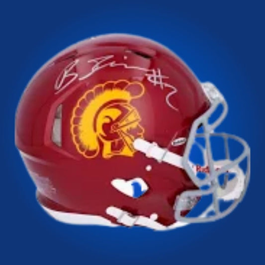Autographed full size Authentic Helmet by Brenden Rice, emerging USC Trojans wide receiver, displayed against a crisp white backdrop for modern appeal. A great collectible for new-era USC fans. SportsMarkets product image.