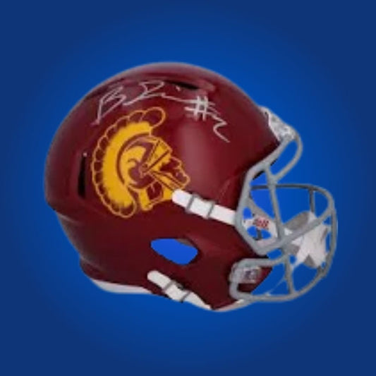 Autographed full size replica helmet by Brendon Rice, dynamic USC Trojans wide receiver, featured on a neutral white background for clarity and emphasis. An excellent addition for collectors and USC fans. SportsMarkets product photo.