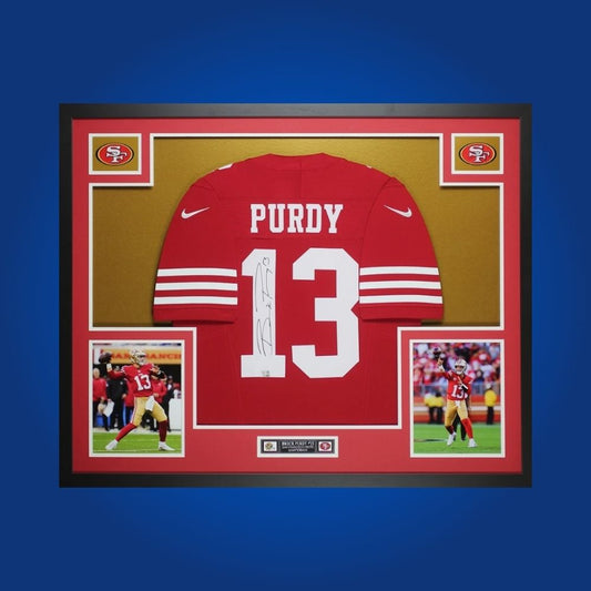 Framed San Francisco 49ers jersey signed by Brock Purdy with action photos and Certificate of Authenticity