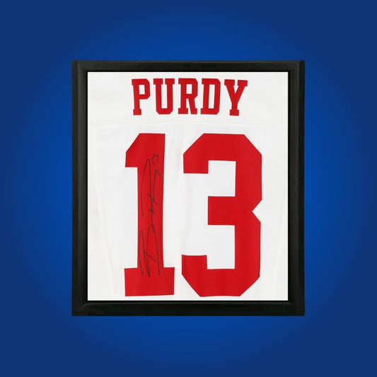 Brock Purdy hand-signed framed San Francisco 49ers jersey, showcasing signature and official team graphics. A unique collectible for 49ers fans and Purdy memorabilia collectors. Includes Certificate of Authenticity. Images may differ for catalog uniformity.