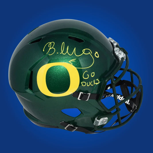 Autographed Oregon Ducks full size replica helmet signed by Bucky Irving, displayed against a clean white background. SportsMarkets memorabilia photo.