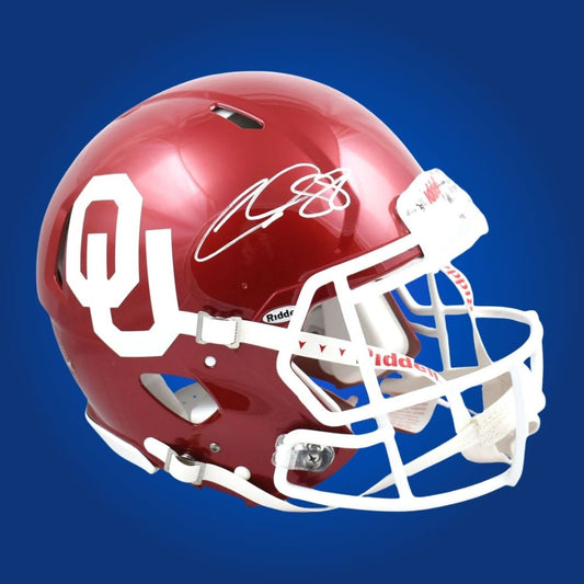 Autographed Oklahoma Sooners full size Authentic Helmet signed by CeeDee Lamb, shown on a white background for product clarity. SportsMarkets exclusive image.