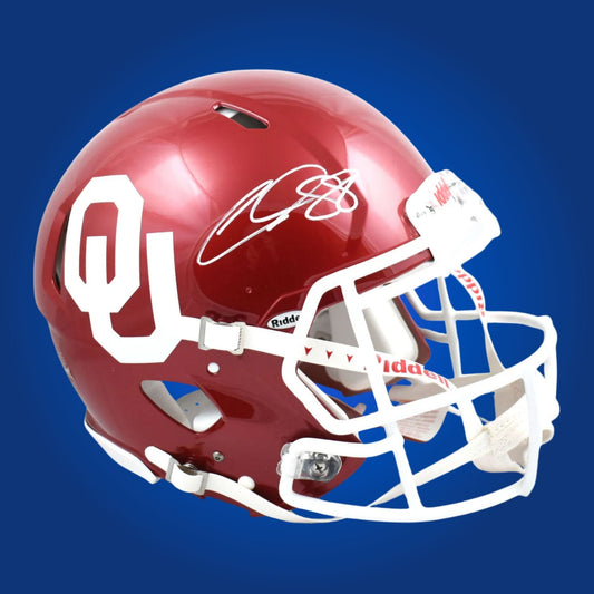 Autographed Oklahoma Sooners full size replica helmet signed by CeeDee Lamb, shown on a white background for product clarity. SportsMarkets exclusive image.