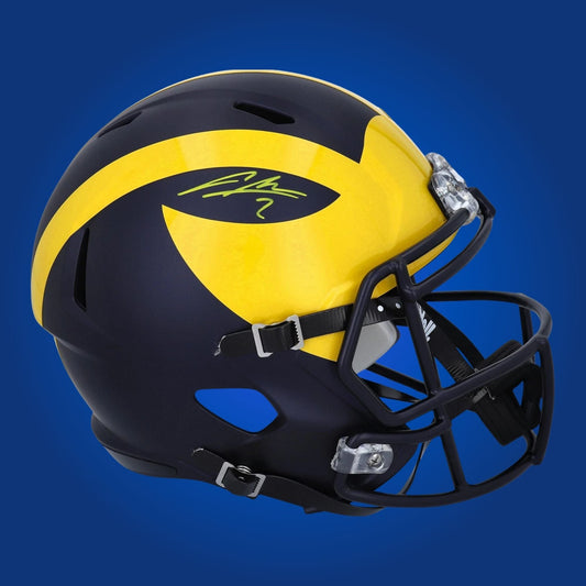 Autographed Michigan Wolverines full size replica helmet signed by Charles Woodson, displayed against a white background. SportsMarkets collectible product image.
