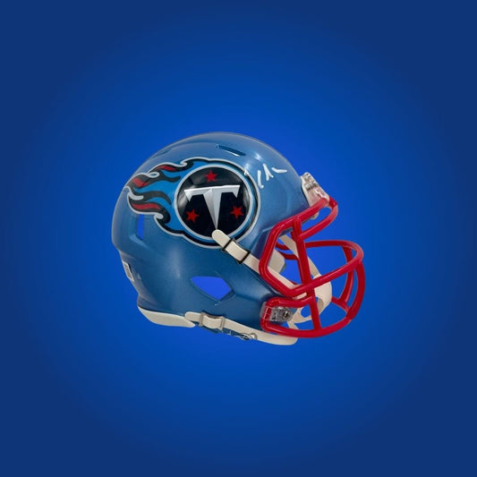 Tennessee Titans mini helmet signed by Chris Johnson with Certificate of Authenticity.