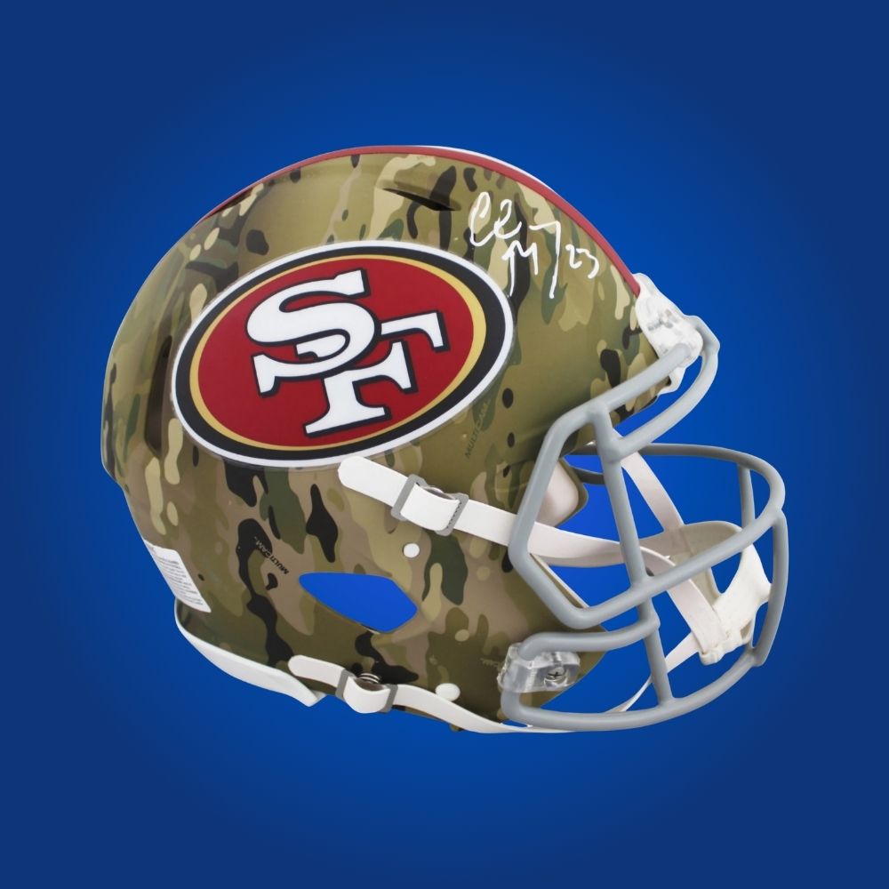 Christian McCaffrey hand-signed military San Francisco 49ers helmet, showcasing signature and official team graphics. A unique collectible for 49ers fans and McCaffrey memorabilia collectors. Includes Certificate of Authenticity. Images may differ for catalog uniformity.
