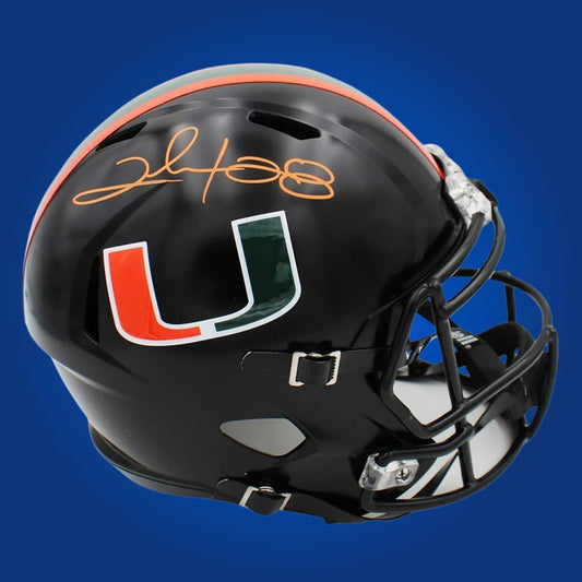 Autographed Miami Hurricanes full size replica helmet signed by Clinton Portis, shown on a white background for product clarity. SportsMarkets memorabilia image.