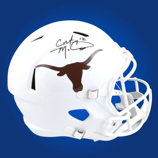 Autographed full size replica helmet by Colt McCoy, Texas Longhorns quarterback, showcased on a crisp white background for a professional product presentation. SportsMarkets memorabilia photo.