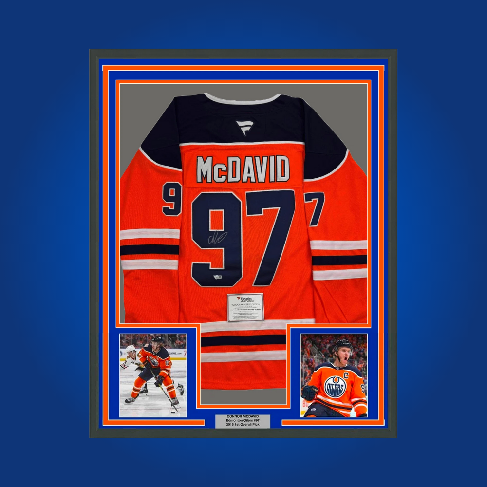 Connor McDavid’s full framed Edmonton Oilers orange jersey, personally autographed, is a premier collectible for fans of the game’s brightest current superstar and Oilers legend in the making.