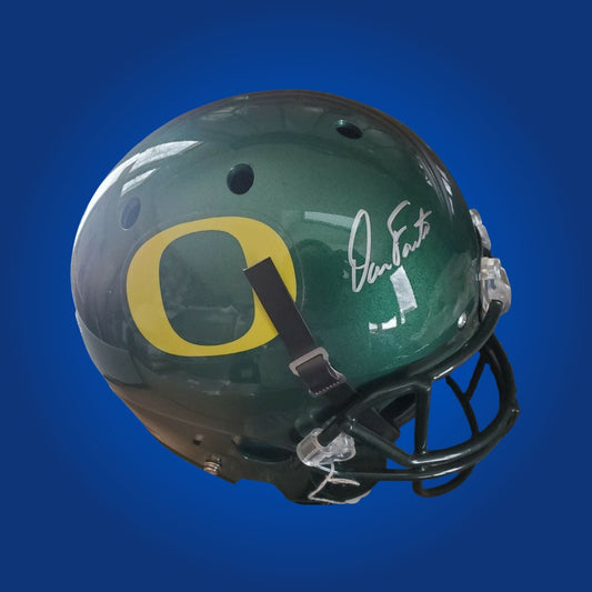 Autographed Oregon Ducks full size replica helmet signed by Dan Fouts, shown on a white background for product clarity. SportsMarkets memorabilia photo.