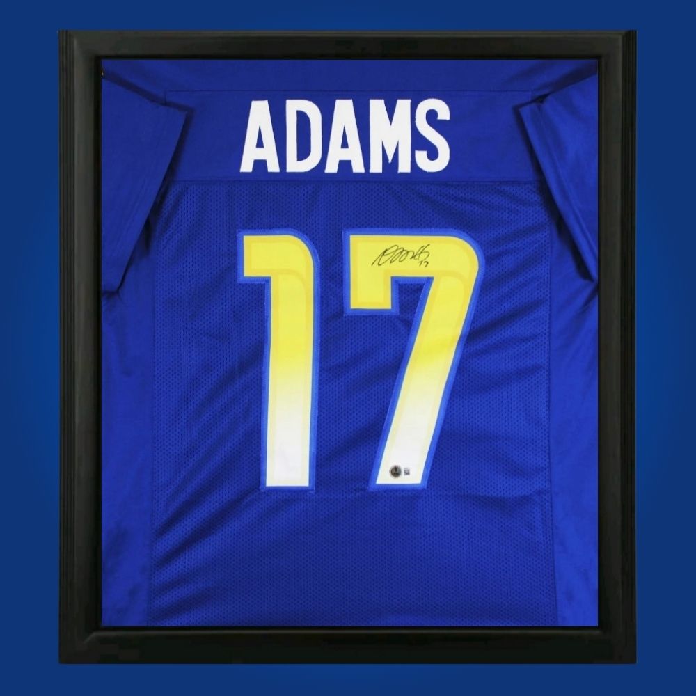Davante Adams hand-signed Los Angeles Rams framed jersey, showcasing signature and official team graphics. A unique collectible for Rams fans and Adams memorabilia collectors. Includes Certificate of Authenticity. Images may differ for catalog uniformity.