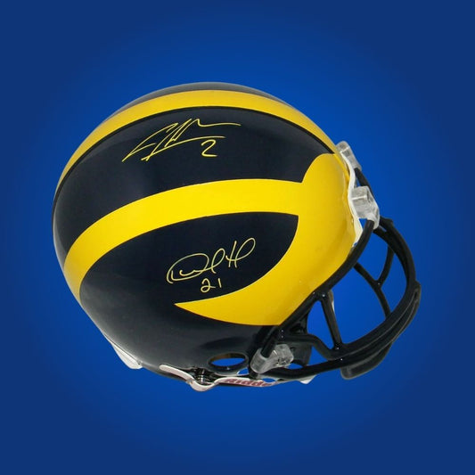 Autographed Michigan Wolverines full size Authentic Helmet signed by Desmond Howard, photographed on a white background. SportsMarkets exclusive memorabilia image.