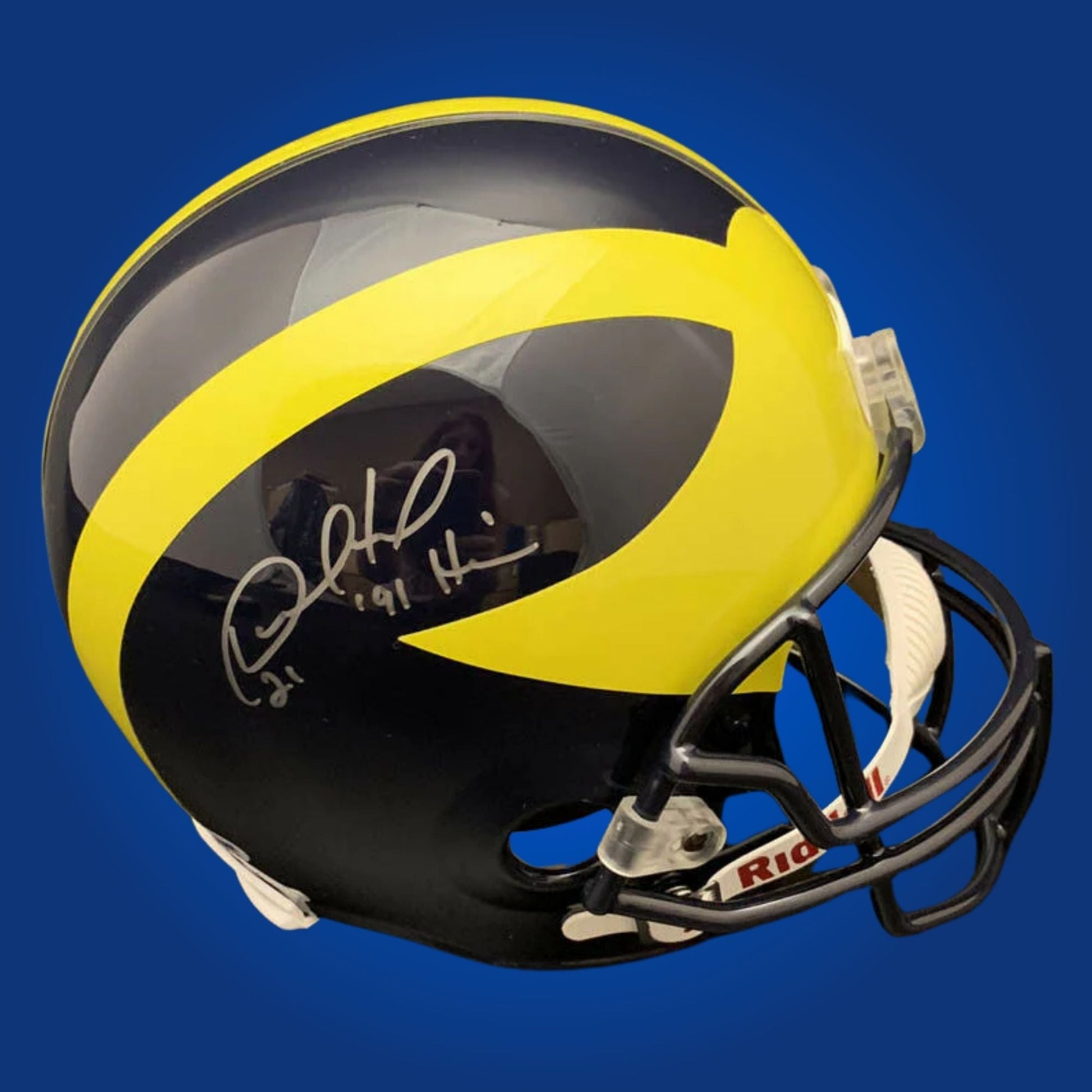 Autographed Michigan Wolverines full size replica helmet signed by Desmond Howard, photographed on a white background. SportsMarkets exclusive memorabilia image.