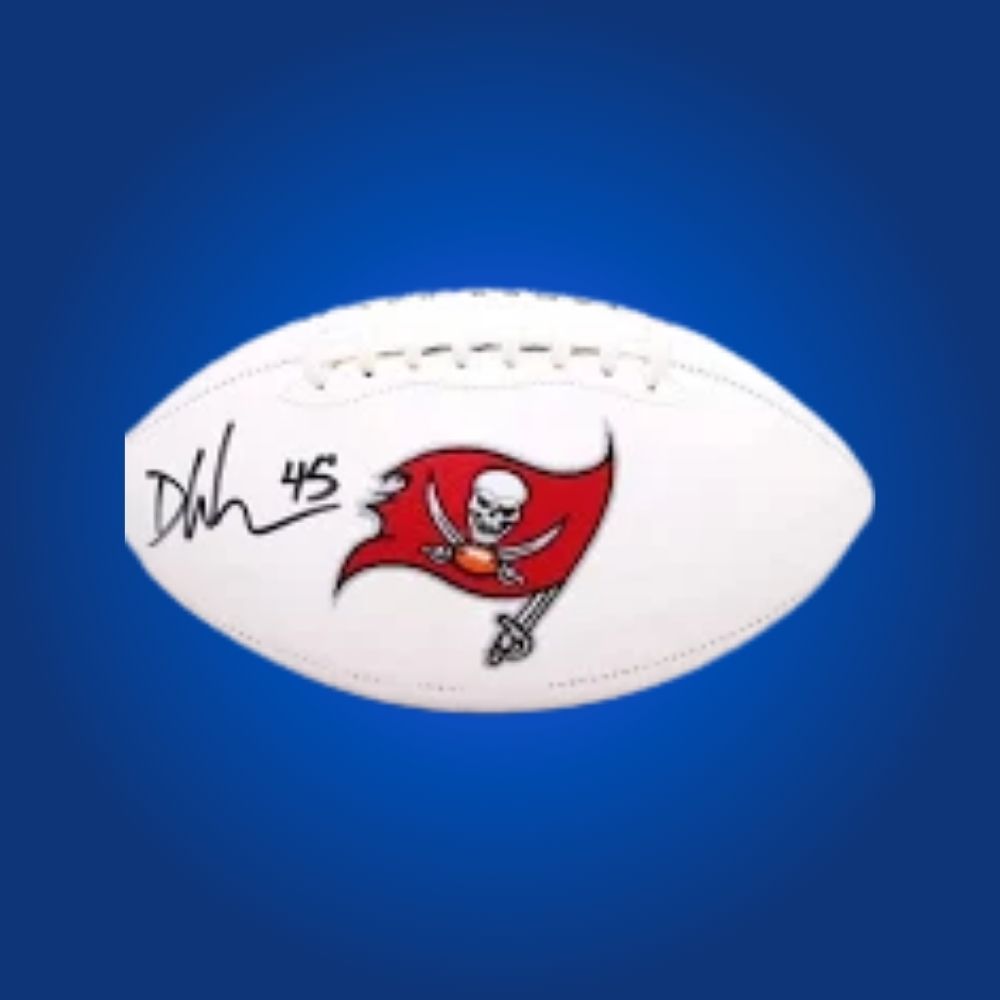 Devin White autographed Buccaneers logo football, with linebacker’s signature and team branding.