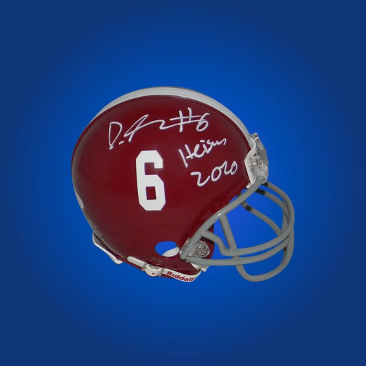 Autographed Alabama Crimson Tide mini helmet by DeVonta Smith, ideal for memorabilia collectors and fans of college football.