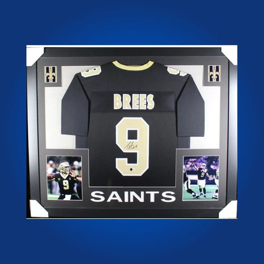 Framed New Orleans Saints jersey signed by Drew Brees with action photos and Certificate of Authenticity